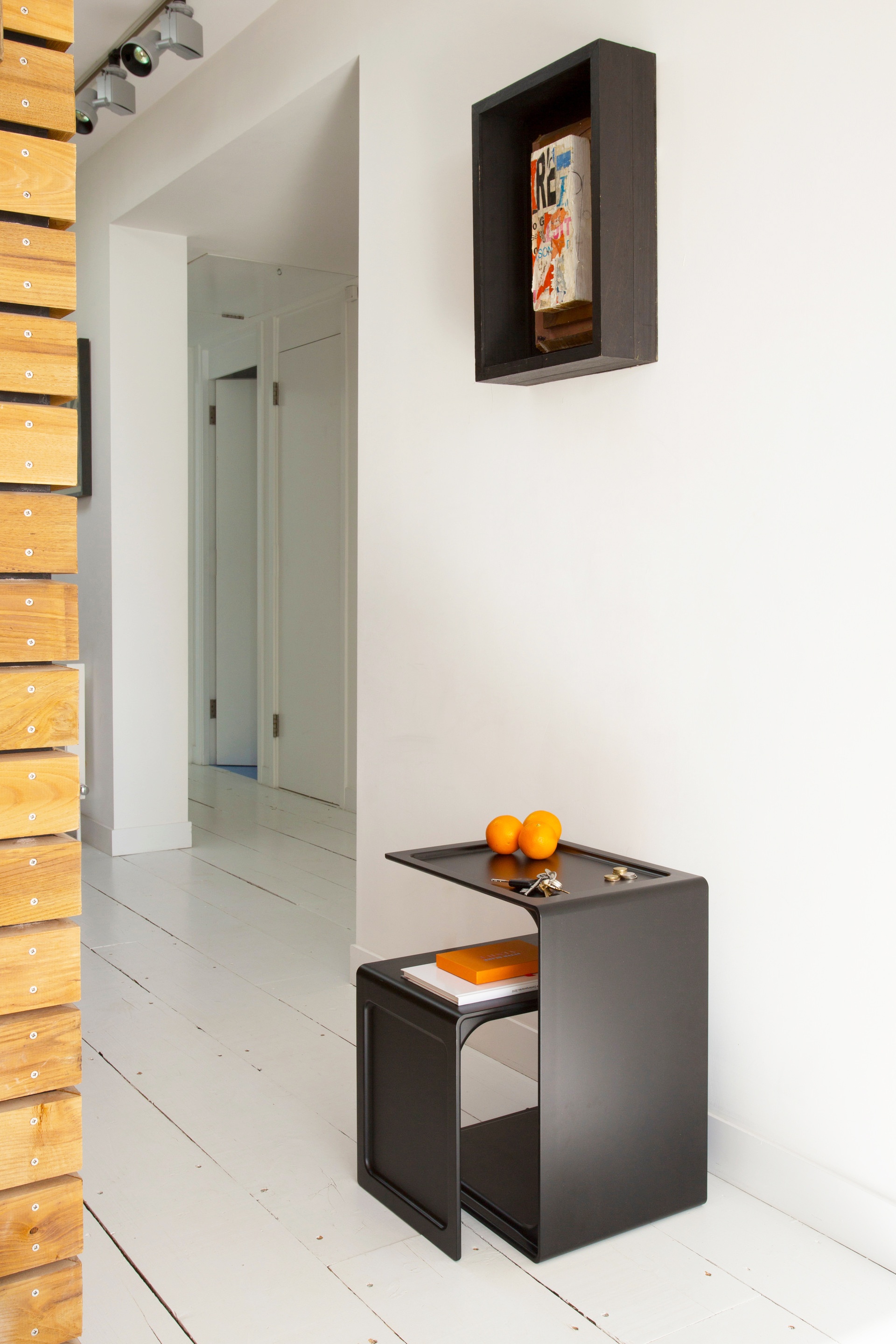 nesting pair side table, black. Hallway. Vitsœ 621 Designer Dieter Rams table.