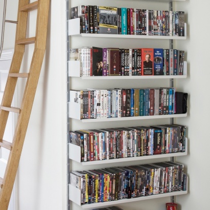 strong metal shelves for DVD large collection. Vitsœ 606 modular shelving system. Designer Dieter Rams