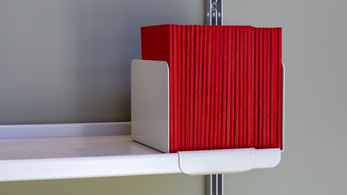 high quality metal bookend for books, vinyl record upright best storage position. Vitsœ shelving. Designer Dieter Rams