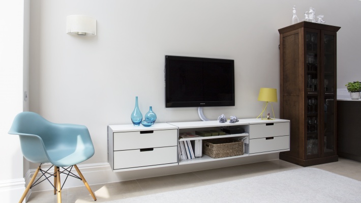 TV stand floating two-drawer cabinets for media storage living room, wall mounted. Vitsœ 606 modular shelving system. Designer Dieter Rams