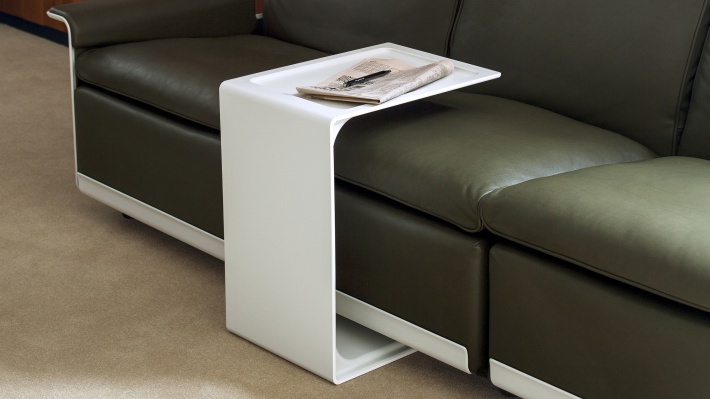 Side table 621 used as a tray for laptop or during reading in a modular sofa, three-seater configuration in Olive brown leather, outer shell in off-white. Nesting pair available.